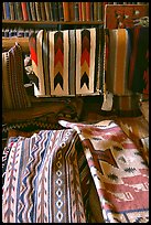 Stacks of varicolored blankets and rugs weaved by Navajo Indians. Hubbell Trading Post National Historical Site, Arizona, USA