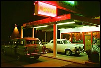 Old American cars in front of motel, Holbrook. Arizona, USA (color)