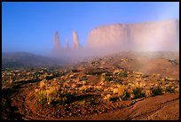Three sisters, clearing fog, morning. Monument Valley Tribal Park, Navajo Nation, Arizona and Utah, USA