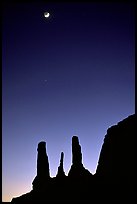 Three sisters and moon, dusk. Monument Valley Tribal Park, Navajo Nation, Arizona and Utah, USA