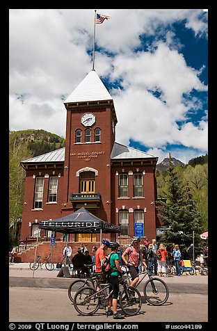 Mountain bikers in front of San Miguel County court house. Telluride, Colorado, USA (color)