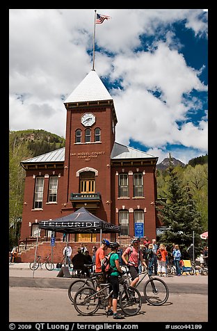 Mountain bikers in front of San Miguel County court house. Telluride, Colorado, USA