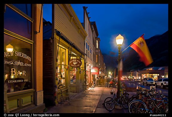 Street with parked bicycles and lamp by night. Telluride, Colorado, USA (color)