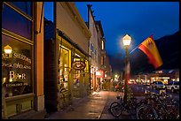 Street with parked bicycles and lamp by night. Telluride, Colorado, USA