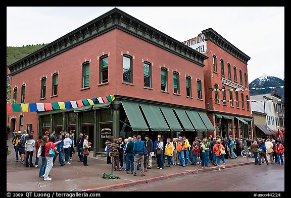 Festival attendees line up on sidewalk. Telluride, Colorado, USA