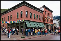 Festival attendees line up on sidewalk. Telluride, Colorado, USA (color)