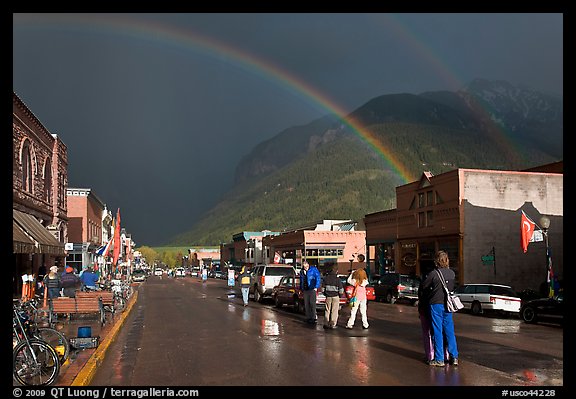 Double rainbow and dark sky over main street. Telluride, Colorado, USA (color)