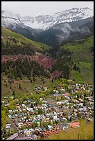 Town, waterfall, and snowy mountains in spring. Telluride, Colorado, USA ( color)