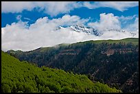 Snowy Mt Wilson emerging from clouds in the spring. Colorado, USA (color)