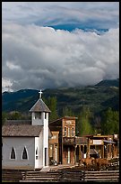 Horses grazing in front of historic-looking buildings, Ridgeway. Colorado, USA (color)