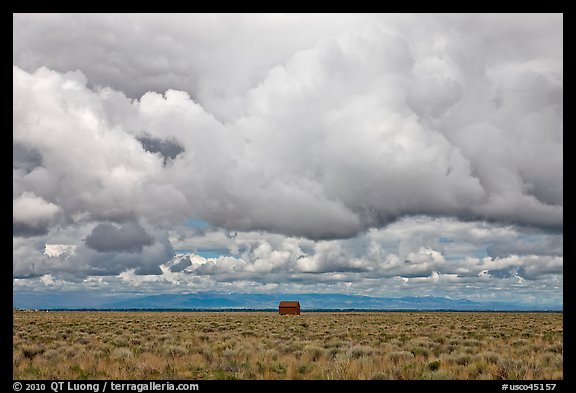 Lonely house on plain under clouds. Colorado, USA