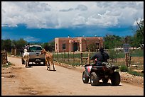 Rural road on the reservation with ATV, truck and horse. Taos, New Mexico, USA ( color)