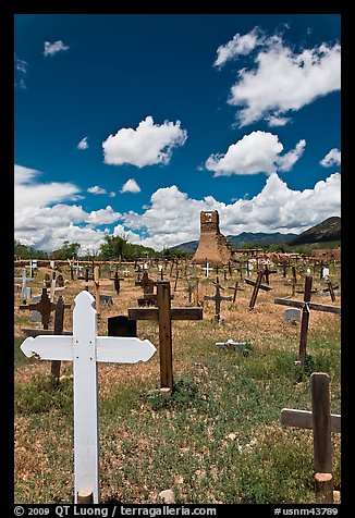 Wooden crosses and old adobe church. Taos, New Mexico, USA