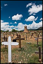 Wooden crosses and old adobe church. Taos, New Mexico, USA