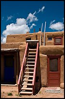 Ladder used to access upper floor of pueblo. Taos, New Mexico, USA (color)