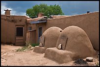 Traditional pueblo ovens. Taos, New Mexico, USA (color)