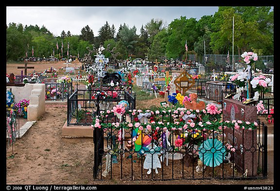 Graves with colorfull flowers. Taos, New Mexico, USA