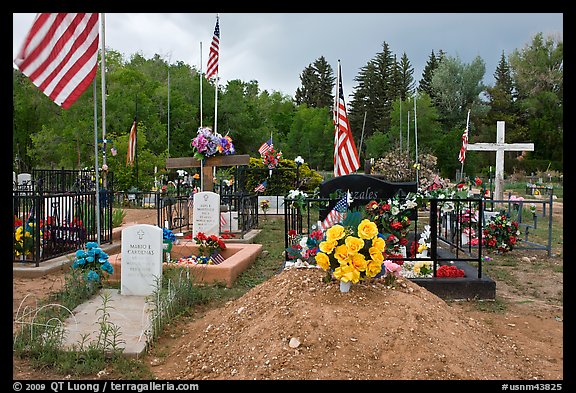 Headstones, tombs and american flags. Taos, New Mexico, USA