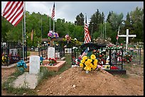 Headstones, tombs and american flags. Taos, New Mexico, USA ( color)