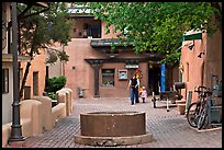 Pedestrian alley with woman and child. Taos, New Mexico, USA