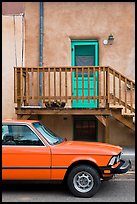 Car and adobe house detail. Taos, New Mexico, USA