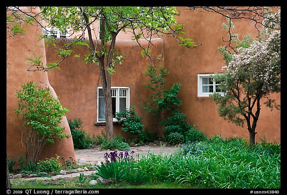 Garden and pueblo revival style building. Taos, New Mexico, USA (color)
