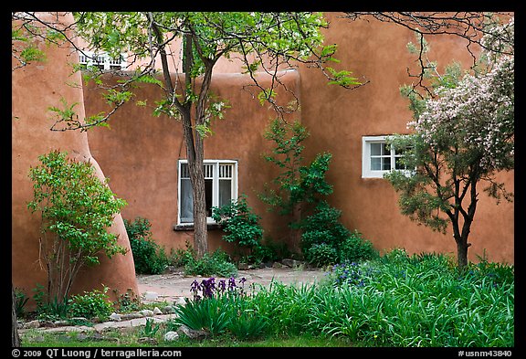 Garden and pueblo revival style building. Taos, New Mexico, USA
