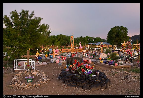 Tomb made of volcanic rocks in cemetery, Rancho de Taos. Taos, New Mexico, USA