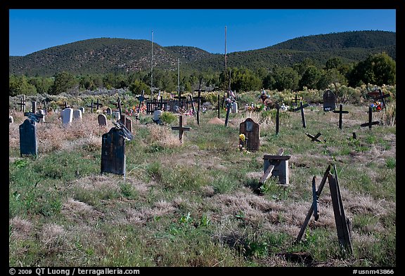 Headstones in grassy area, cemetery, Picuris Pueblo. New Mexico, USA