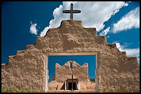 Adobe church framed by entrance in earthen wall, Picuris Pueblo. New Mexico, USA (color)