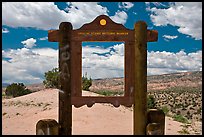 Historic marker framing high desert landscape. New Mexico, USA (color)