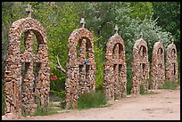 Brick and stone crosses by the river, Sanctuario de Chimayo. New Mexico, USA