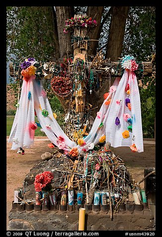 Cross festoned with popular devotion objects, Sanctuario de Chimayo. New Mexico, USA