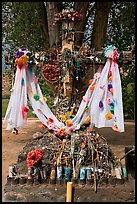 Cross festoned with popular devotion objects, Sanctuario de Chimayo. New Mexico, USA