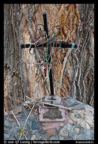 Metal cross festoned with rosaries, and crosses made of twigs, Sanctuario de Chimayo. New Mexico, USA