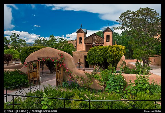 Gardens and walled courtyard, Sanctuario de Chimayo. New Mexico, USA