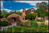 Gardens and walled courtyard, Sanctuario de Chimayo. New Mexico, USA (color)