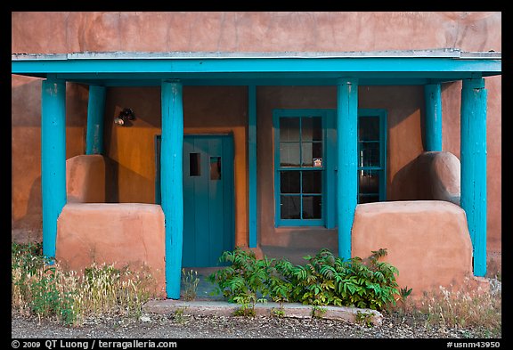 Blue and adobe house porch. Santa Fe, New Mexico, USA