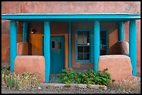 Blue and adobe house porch. Santa Fe, New Mexico, USA