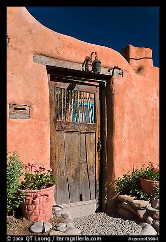 Wooden door and adobe wall. Santa Fe, New Mexico, USA
