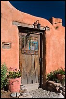 Wooden door and adobe wall. Santa Fe, New Mexico, USA