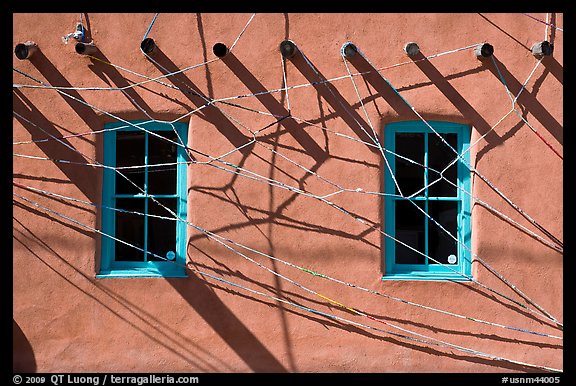 Detail of art installation on facade of adobe building. Santa Fe, New Mexico, USA