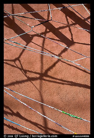 Shadows of vigas (wooden beams) and strings made of plastic bags. Santa Fe, New Mexico, USA (color)