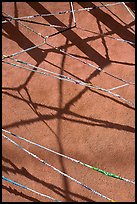 Shadows of vigas (wooden beams) and strings made of plastic bags. Santa Fe, New Mexico, USA