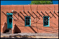 Adobe building tied up with plastic bags. Santa Fe, New Mexico, USA