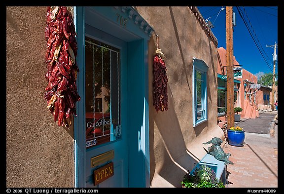 Ristras hanging in front of art gallery, Canyon Road. Santa Fe, New Mexico, USA