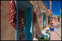 Ristras hanging in front of art gallery, Canyon Road. Santa Fe, New Mexico, USA (color)