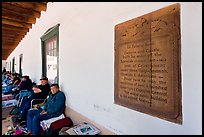 Sign explaining history of Palace of the Governors. Santa Fe, New Mexico, USA