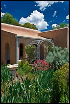 Garden and adobe house. Santa Fe, New Mexico, USA
