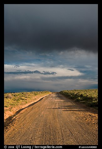 Dirt road under storm clouds. New Mexico, USA